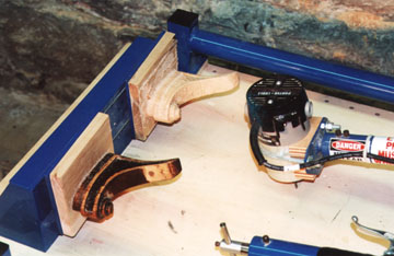 Photo of chair wing being carved.